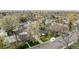 An aerial view of a home in a neighborhood full of mature trees, showcasing the surrounding area at 4433 S Washington St, Englewood, CO 80113