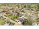 A high aerial view shows the home in the neighborhood, highlighting the landscape, yard, and trees at 4433 S Washington St, Englewood, CO 80113