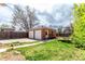 Private backyard with a detached two-car garage and trampoline for recreational use at 4433 S Washington St, Englewood, CO 80113