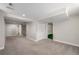 Spacious basement featuring neutral carpeting, white trim, and access to storage and bathroom at 4433 S Washington St, Englewood, CO 80113