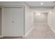 Finished basement area with neutral carpet and paint and a double door closet at 4433 S Washington St, Englewood, CO 80113