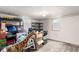 Unfinished basement with empty shelves and boxes is ready for your imagination at 4433 S Washington St, Englewood, CO 80113