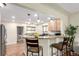 Modern kitchen with stainless steel appliances, granite countertops, and an open layout at 4433 S Washington St, Englewood, CO 80113