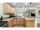 Stylish kitchen featuring granite countertops and modern appliances, with a view to the living area at 4433 S Washington St, Englewood, CO 80113