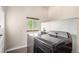 Laundry room with a window and newer model washer and dryer at 4433 S Washington St, Englewood, CO 80113