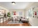 Cozy living room featuring a comfortable sectional, hardwood floors, and barstool seating at 4433 S Washington St, Englewood, CO 80113