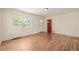 Inviting living room with hardwood floors, a front door view, and lots of natural light at 4433 S Washington St, Englewood, CO 80113