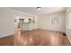 Open living space connecting to the kitchen, with hardwood floors and bright natural light at 4433 S Washington St, Englewood, CO 80113