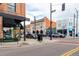 Street view featuring local shops, restaurants, and street parking at 4433 S Washington St, Englewood, CO 80113