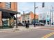 A street view of the town, featuring a mix of brick and vintage-style buildings on a sunny day at 4433 S Washington St, Englewood, CO 80113