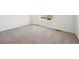 Bright bedroom featuring neutral carpet, white walls, and natural light at 45952 Gentry Ave, Bennett, CO 80102