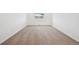 Bright bedroom with neutral carpet and a window offering natural light at 45952 Gentry Ave, Bennett, CO 80102