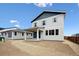 Charming two-story home features a covered patio, neutral siding, and an unfinished yard at 45952 Gentry Ave, Bennett, CO 80102