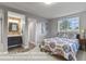 Basement bedroom showcasing a comfortable bed and an attached bathroom with modern fixtures and design at 3973 Palmer Ridge Dr, Parker, CO 80134