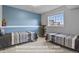Basement bedroom featuring two beds and ample natural light, providing a cozy and inviting space at 3973 Palmer Ridge Dr, Parker, CO 80134