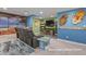 Cozy basement movie room with comfortable seating and a large screen for ultimate entertainment at 3973 Palmer Ridge Dr, Parker, CO 80134