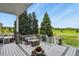 Inviting deck features a cozy seating area, a fire pit, and stunning views of the surrounding landscape at 3973 Palmer Ridge Dr, Parker, CO 80134