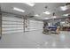 Spacious three-car garage with ample storage and work space at 3973 Palmer Ridge Dr, Parker, CO 80134