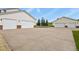 A house with two detached three-car garages separated by a long driveway at 3973 Palmer Ridge Dr, Parker, CO 80134