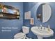 Stylish half-bath with modern fixtures, a unique vanity, and decorative mirror at 3973 Palmer Ridge Dr, Parker, CO 80134