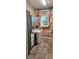 Functional laundry room featuring a washer, dryer, utility sink, and charming mural for a cozy feel at 3973 Palmer Ridge Dr, Parker, CO 80134