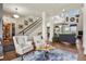 Spacious living room with high ceilings, hardwood floors, and an open floor plan at 3973 Palmer Ridge Dr, Parker, CO 80134