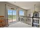 Upstairs loft with large windows and sliding door showcasing scenic views at 3973 Palmer Ridge Dr, Parker, CO 80134