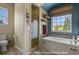 Well-lit primary bath features a soaking tub with a window view, a separate shower, and modern fixtures at 3973 Palmer Ridge Dr, Parker, CO 80134