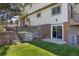 Large backyard has a multi-level retaining wall, steps and basement access at 9025 Rocky Mountain Ln, Parker, CO 80138