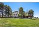 Back exterior featuring a deck and walkout basement at 9025 Rocky Mountain Ln, Parker, CO 80138