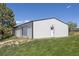 Wide angle of metal building on a beautiful green lawn against a blue sky at 9025 Rocky Mountain Ln, Parker, CO 80138
