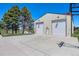 A basketball court sits outside a barn with two bays at 9025 Rocky Mountain Ln, Parker, CO 80138