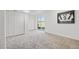 Basement with carpet, closet, sliding glass door, and wall decor at 9025 Rocky Mountain Ln, Parker, CO 80138