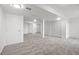 Spacious basement offers carpet, white walls, storage, and recessed lighting at 9025 Rocky Mountain Ln, Parker, CO 80138