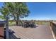 An outdoor deck is set up with seating and a hot tub, providing stunning views of the surrounding landscape at 9025 Rocky Mountain Ln, Parker, CO 80138