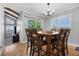 Dining room with a large table, natural light, and hardwood floors at 9025 Rocky Mountain Ln, Parker, CO 80138