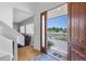 Welcoming entryway featuring a view of the front yard and a glimpse into a cozy living space at 9025 Rocky Mountain Ln, Parker, CO 80138