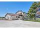 Exterior elevation features a multilevel deck, spacious yard, and partial basketball court at 9025 Rocky Mountain Ln, Parker, CO 80138