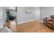 Inviting hallway with gleaming hardwood floors and neutral wall colors, showcasing the home's seamless transition between spaces at 9025 Rocky Mountain Ln, Parker, CO 80138