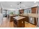 Modern kitchen with an island that includes a wine rack and granite countertops at 9025 Rocky Mountain Ln, Parker, CO 80138