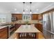 Bright kitchen featuring granite countertops, stainless steel appliances, and a center island at 9025 Rocky Mountain Ln, Parker, CO 80138