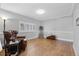 Inviting living room with hardwood floors and a cozy chair near a window at 9025 Rocky Mountain Ln, Parker, CO 80138