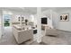 Basement living room with ample seating and a pool table in the background at 9025 Rocky Mountain Ln, Parker, CO 80138