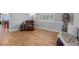 Cozy living room featuring hardwood floors, ample natural light, and a vintage charm at 9025 Rocky Mountain Ln, Parker, CO 80138