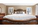 This main bedroom features a large bed and two windows at 9025 Rocky Mountain Ln, Parker, CO 80138