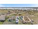 Scenic aerial view showcasing a rural neighborhood near a body of water and open fields at 13619 Lake Ave, Brighton, CO 80603