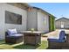 Outdoor sitting area with a charming patio set on a well-maintained lawn at 13619 Lake Ave, Brighton, CO 80603