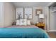 Cozy bedroom featuring a comfortable bed with stylish decor and a convenient nightstand at 13619 Lake Ave, Brighton, CO 80603