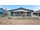 Charming single-story gray home with a fenced yard, showcasing a welcoming entrance at 13619 Lake Ave, Brighton, CO 80603