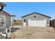 Detached garage offering ample space and functionality, with an adjacent yard at 13619 Lake Ave, Brighton, CO 80603
